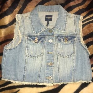 Denim jacket with no sleeves.